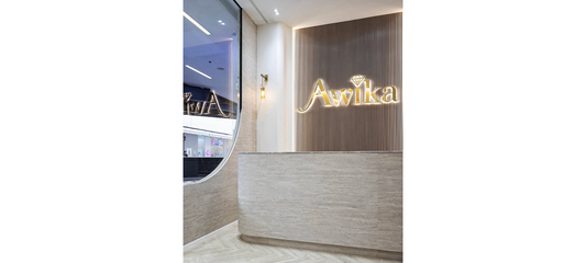 Curved Reception Desk with Travertine-Style Flexible Wall Panels